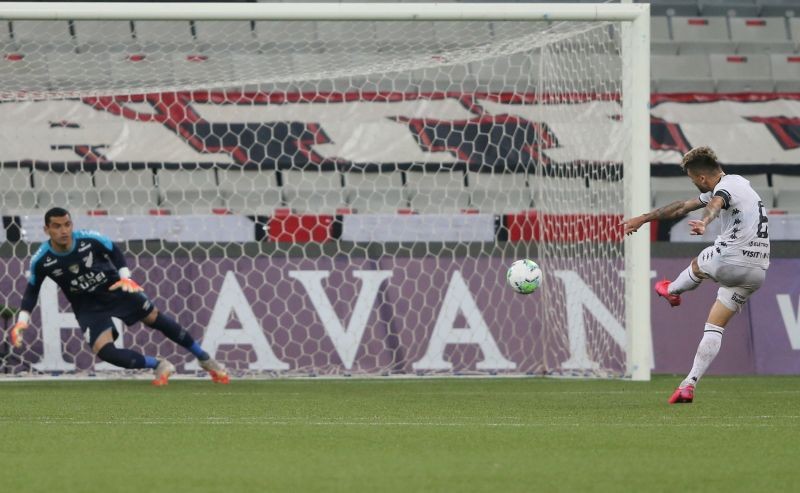 Botafogo's Victor Luis scores their first goal. REUTERS/Rodolfo Buhrer
