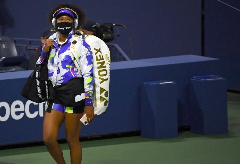 Naomi Osaka (JPN) walks onto the court wearing a Breonna Taylor mask before the match against Misaki Doi (JPN) on day one of the 2020 U.S. Open tennis tournament at USTA Billie Jean King National Tennis Center. Robert Deutsch-USA TODAY Sports/Reuters