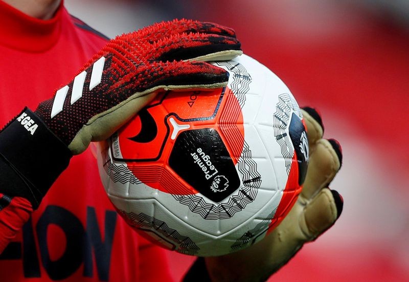 FILE PHOTO: General view of a match ball held by Manchester United's David de Gea during the warm up before the match Action Images via Reuters/Lee Smith