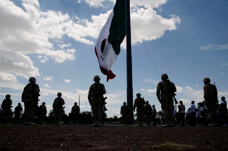 Members of Mexico's National Guard stand in formation as they hold a minute of silence as part of a 30-day national mourning for the deaths and infections caused by the coronavirus disease (COVID-19), in Ciudad Juarez, Mexico on September 1, 2020. (REUTERS Photo)