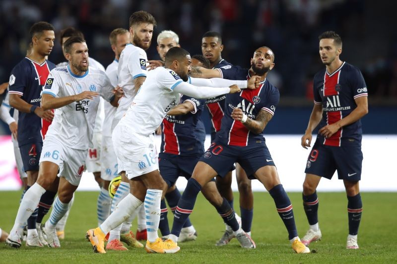 Olympique de Marseille's Jordan Amavi clashes with Paris St Germain's Layvin Kurzawa REUTERS/Gonzalo Fuentes