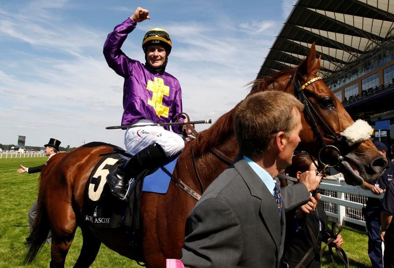 FILE PHOTO: Jockey Pat Smullen celebrates on Rite of Passage after winning the Gold Cup race on the third day of horse racing at Royal Ascot in southern England June 17, 2010. REUTERS/Stefan Wermuth/File Photo