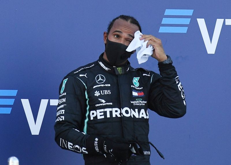 FILE PHOTO: Third placed Mercedes' Lewis Hamilton on the podium after the race. Pool via REUTERS/Kirill Kudryavtsev/File Photo