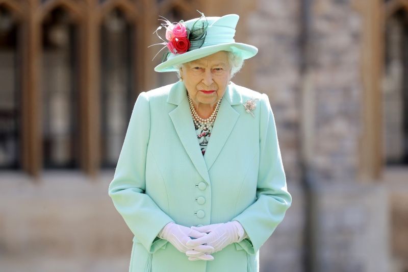 Britain's Queen Elizabeth poses after awarding Captain Tom Moore with the insignia of Knight Bachelor at Windsor Castle, in Windsor, Britain on July 17, 2020. (REUTERS File Photo)
