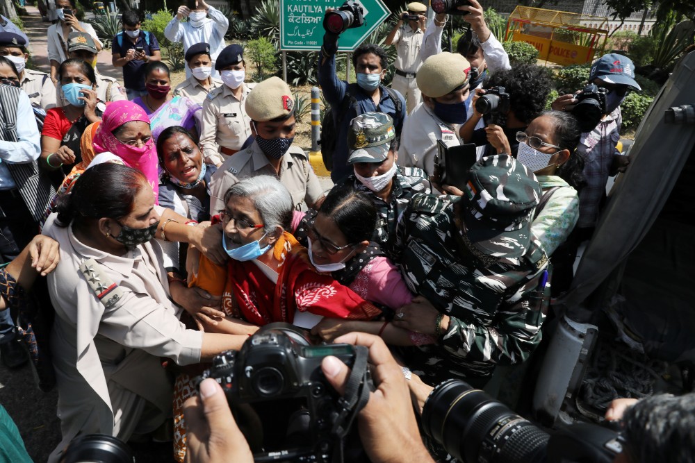 Demonstrators are detained by police during a protest after the death of a rape victim, in front of Uttar Pradesh state bhawan (building) in New Delhi, India, September 30, 2020. REUTERS/Anushree Fadnavis