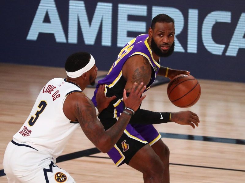 Los Angeles Lakers forward LeBron James (23) is defended by Denver Nuggets forward Torrey Craig (3) during the first half in game five of the Western Conference Finals of the 2020 NBA Playoffs at AdventHealth Arena. (USA TODAY Sports Photo via Reuters)