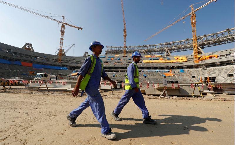 Workers are seen inside the Lusail stadium which is under construction for the upcoming 2022 Fifa soccer World Cup during a stadium tour in Doha, Qatar on December 20, 2019. (REUTERS File Photo)