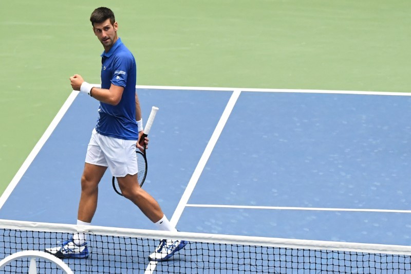 Novak Djokovic of Serbia gestures to his team in the stands after his match against Kyle Edmund of the United Kingdom (not pictured) on day three of the 2020 U.S. Open tennis tournament at USTA Billie Jean King National Tennis Center. Danielle Parhizkaran-USA TODAY Sports/Reuters