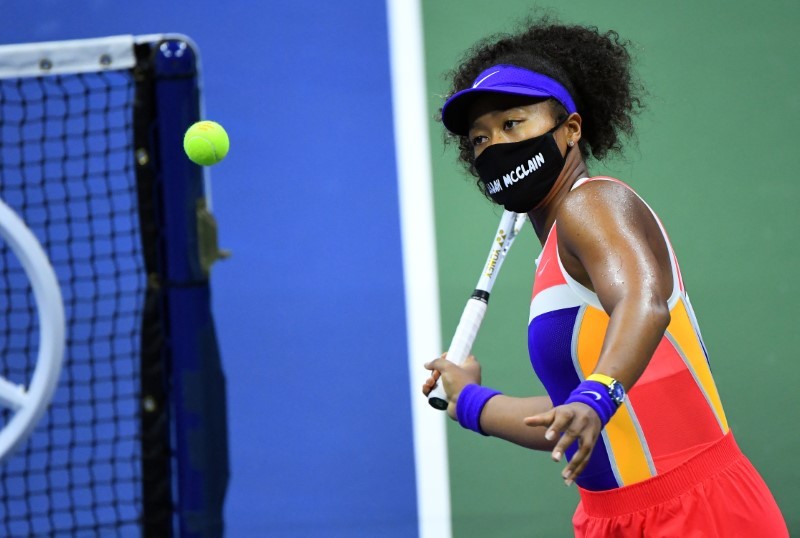 Naomi Osaka of Japan hits balls into the stands following her match against Camila Giorgi of Italy on day three of the 2020 U.S. Open tennis tournament at USTA Billie Jean King National Tennis Center. Robert Deutsch-USA TODAY Sports/Reuters