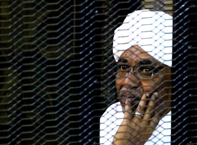 Sudan's former president Omar Hassan al-Bashir sits inside a cage at the courthouse where he is facing corruption charges, in Khartoum, Sudan on September 28, 2019. (REUTERS File Photo)