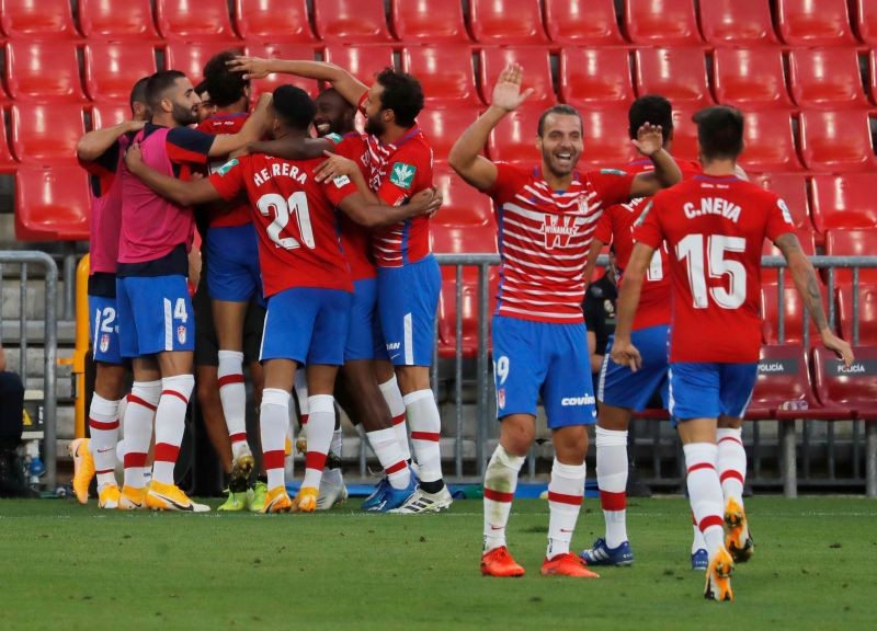 Granada's Luis Milla celebrates scoring their second goal with teammates REUTERS/Jon Nazca