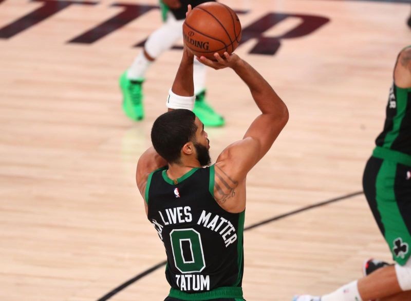 Boston Celtics forward Jayson Tatum (0) shoots against the Miami Heat during the second half in game five of the Eastern Conference Finals of the 2020 NBA Playoffs at AdventHealth Arena. (USA TODAY Sports Photo via Reuters)