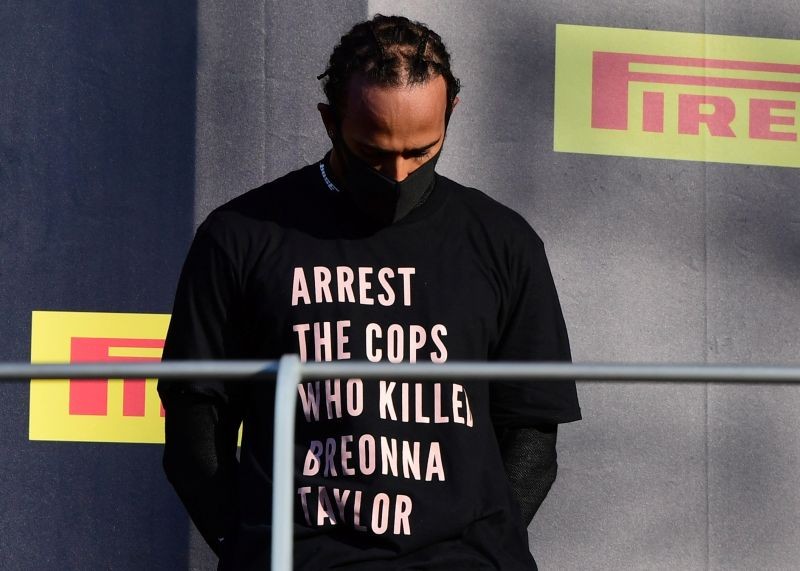 Mercedes' Lewis Hamilton wears a shirt in reference to Breonna Taylor on the podium as he celebrates after winning the race Pool via REUTERS/Jennifer Lorenzini