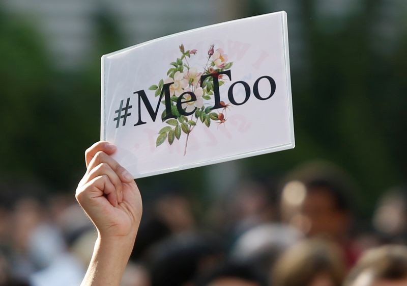 A protester raises a placard reading "#MeToo" during a rally against harassment at Shinjuku shopping and amusement district in Tokyo, Japan, April 28, 2018. (REUTERS File Photo)