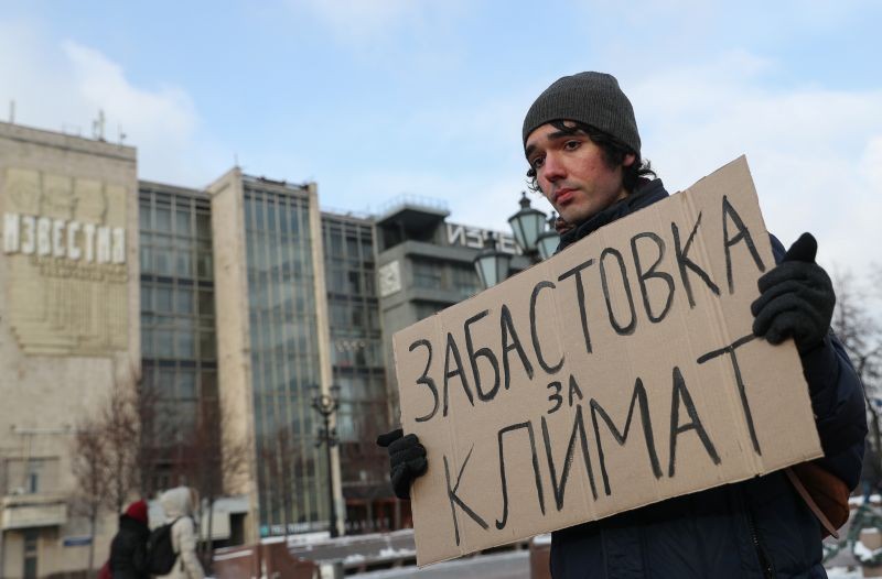 Climate activist Arshak Makichyan holds a cardboard reading "Strike for Climate" during a single-person demonstration in central Moscow, Russia on February 7, 2020. (REUTERS File Photo)