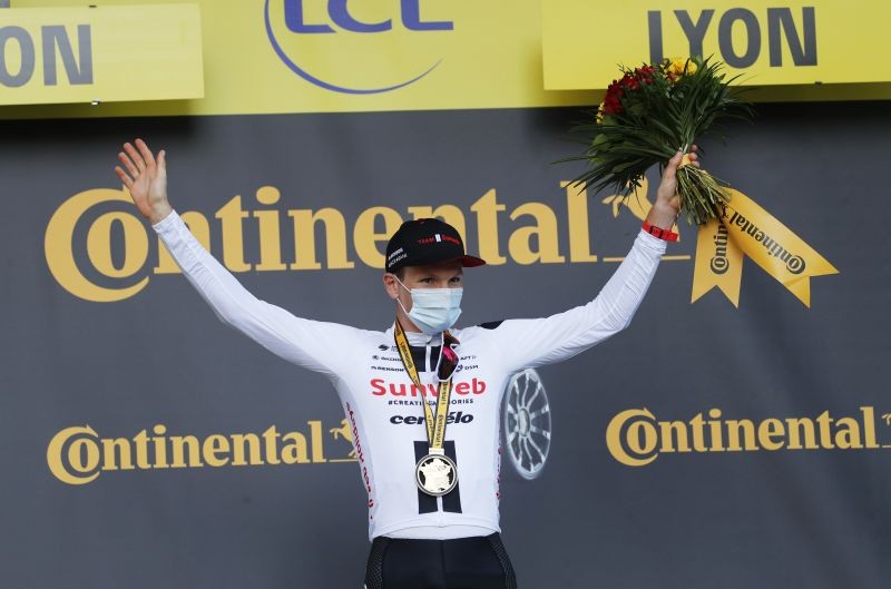 Cycling - Tour de France - Stage 14 - Clermont-Ferrand to Lyon - France - September 12, 2020. Team Sunweb rider Soren Kragh Andersen of Denmark celebrates on the podium Pool via REUTERS/Christophe Ena