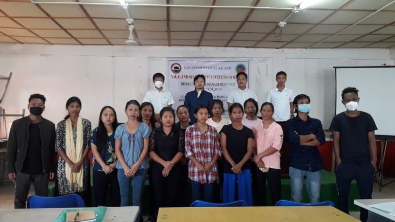 Participants with officials during the Mon District NSRLM training for new Bank Sakhi and refresher course for present and Bank Sakhi and Block AC-FIs conducted at Mon, DRDA Conference Hall on September 28 and 29.