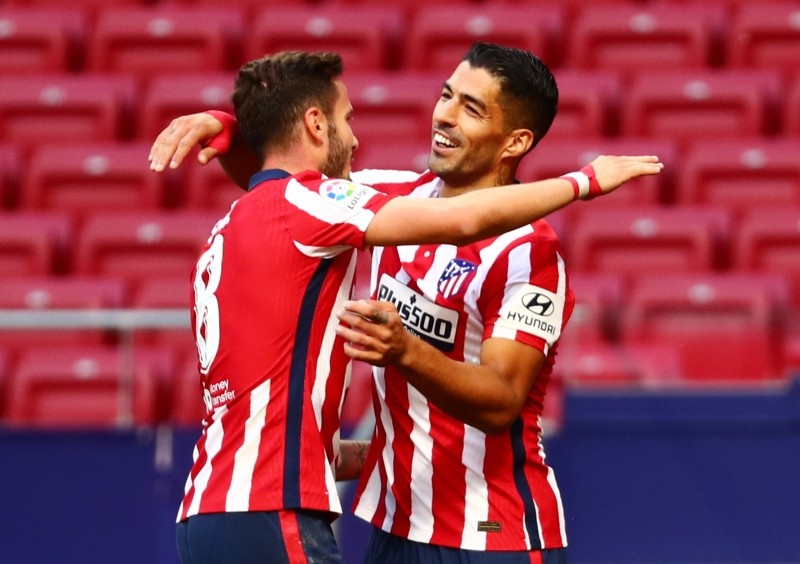 Soccer Football - La Liga Santander - Atletico Madrid v Granada - Wanda Metropolitano, Madrid, Spain - September 27, 2020. Atletico Madrid's Luis Suarez celebrates scoring their sixth goal with Saul Niguez REUTERS/Sergio Perez