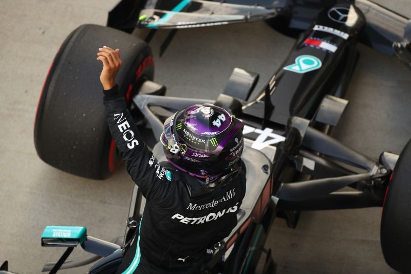 Lewis Hamilton celebrates qualifying in pole position. Pool via REUTERS/Bryn Lennon