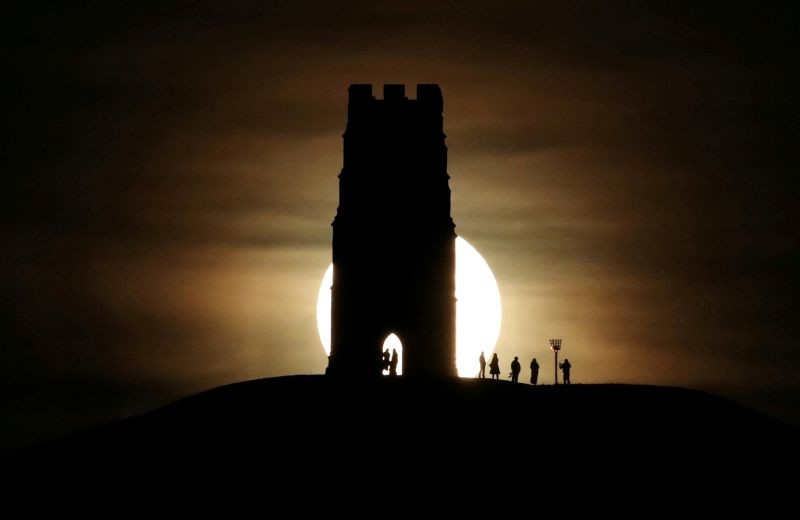 St Michael's Tower is seen on Glastonbury Tor as a full moon rises in Glastonbury, England on January 10, 2020. (REUTERS File Photo)