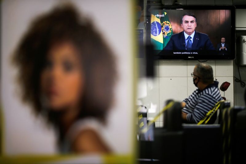 Brazil's President Jair Bolsonaro is seen on a tv screen in a beauty salon as he speaks in a video recorded speech for the 75th session of the United Nations General Assembly, in Brasilia, Brazil on September 22, 2020. (REUTERS Photo)