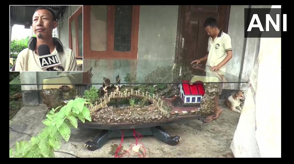 Image showing the sculptor Ningwon Zingkhai (inset) with his creation. (Photo Courtesy: @ANI/Twitter)