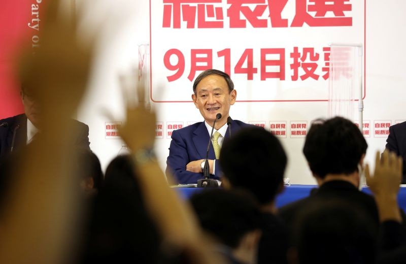 Japan's ruling Liberal Democratic Party (LDP) leadership candidate Japanese Chief Cabinet Secretary Yoshihide Suga looks on as members of the media raise their hands during a news conference at the party headquarters in Tokyo, Japan on September 8, 2020.   (REUTERS Photo)