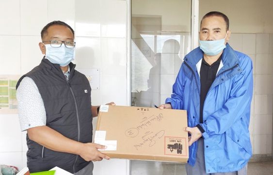 (Left to Right) Wango Langsym, Assistant Director, Social Welfare, Dr Thorhusie Katiry, Managing Director (NHAK) handing over the IT items for implementation of UDID Project.