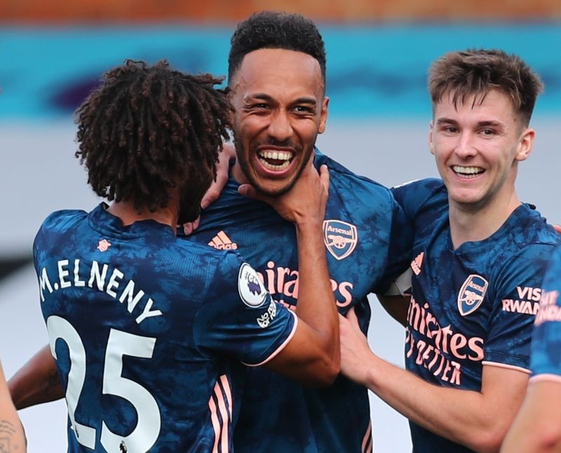 Arsenal's Pierre-Emerick Aubameyang celebrates scoring their third goal with Kieran Tierney and Mohamed Elneny Pool via REUTERS/Clive Rose