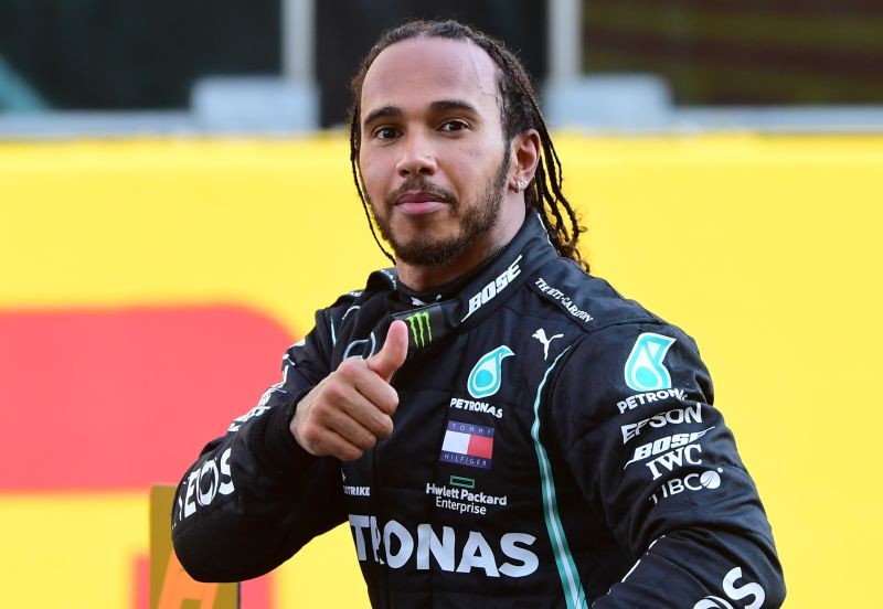 Mercedes' Lewis Hamilton celebrates after winning the race (Pool via REUTERS/Jennifer Lorenzini)