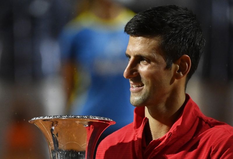 Novak Djokovic celebrates with the trophy after winning the final against Argentina's Diego Schwartzman Pool via REUTERS/Riccardo Antimiani