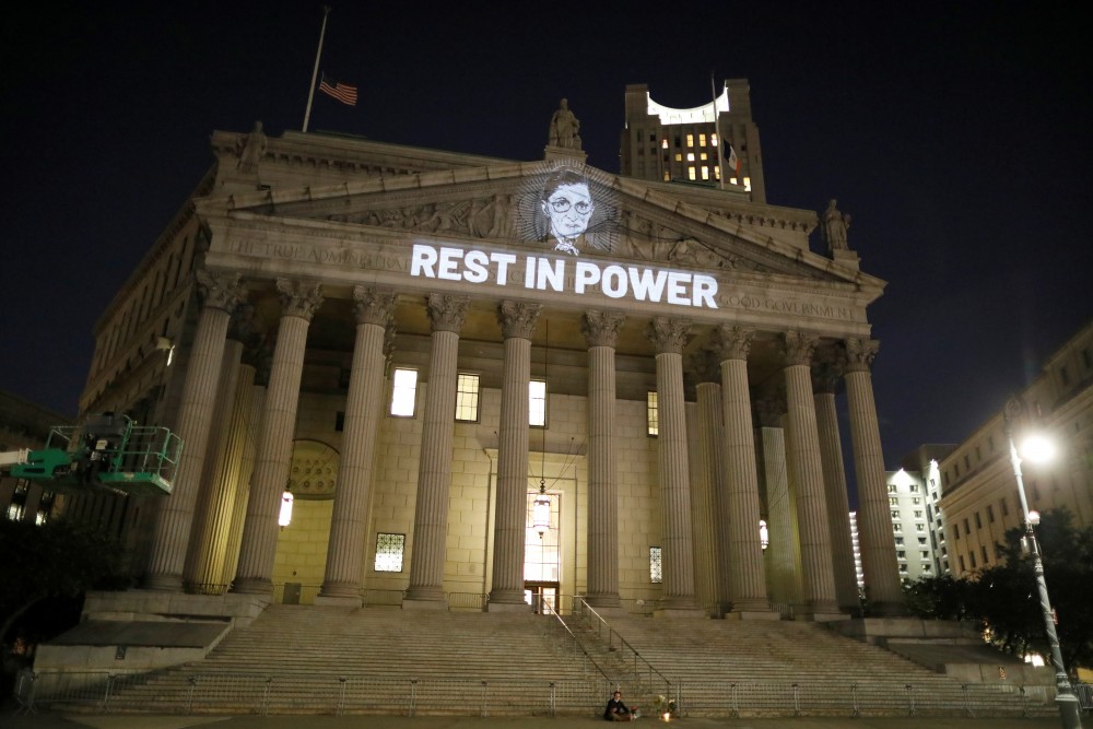 An image of Associate Justice of the Supreme Court of the United States Ruth Bader Ginsburg is projected onto the New York State Civil Supreme Court building in Manhattan, New York City, U.S. after she passed away September 18, 2020. REUTERS/Andrew Kelly