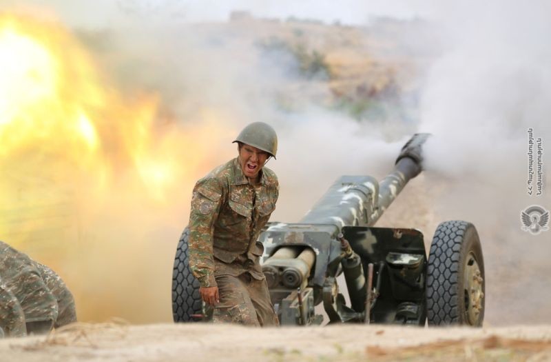 An ethnic Armenian soldier fires an artillery piece during fighting with Azerbaijan's forces in the breakaway region of Nagorno-Karabakh, in this handout picture released on September 29, 2020. (REUTERS Photo)