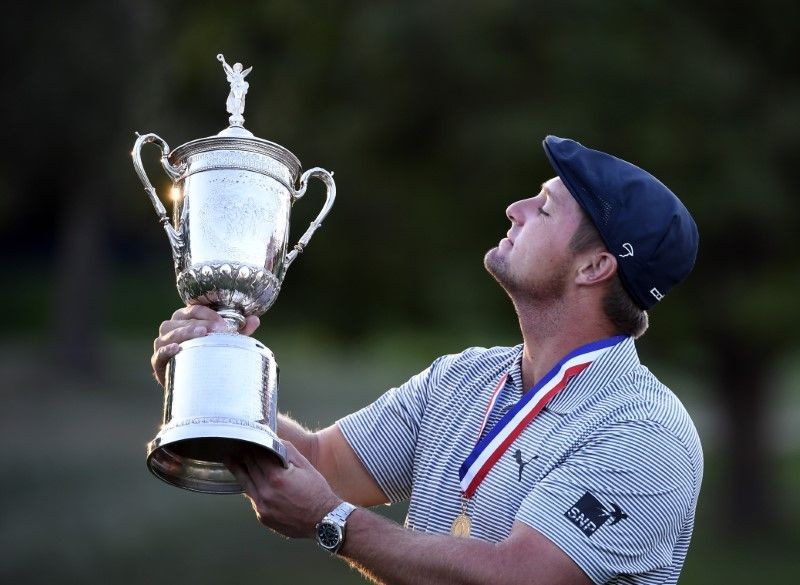 Bryson DeChambeau poses and celebrates with the trophy after winning the U.S. Open golf tournament at Winged Foot Golf Club - West. Mandatory Credit: Danielle Parhizkaran-USA TODAY Sports