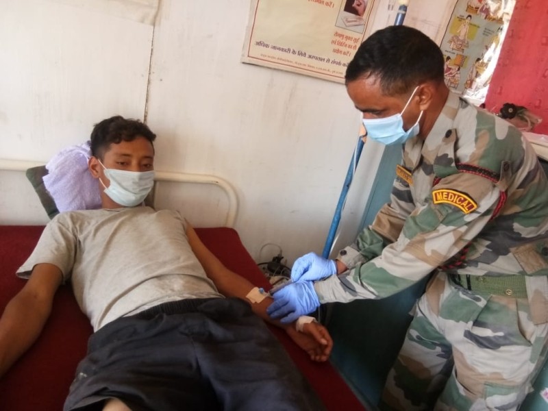 The snake bite victim being provided with medical aid. 