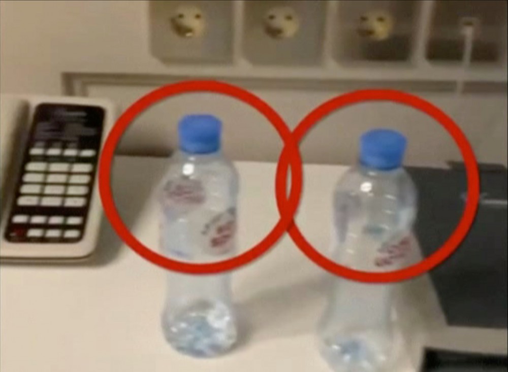 Water bottles are seen in a hotel room where Russian opposition politician Alexei Navalny stayed during his recent visit in the Siberian city of Tomsk. Red marks are from source. (@NAVALNY/via REUTERS)