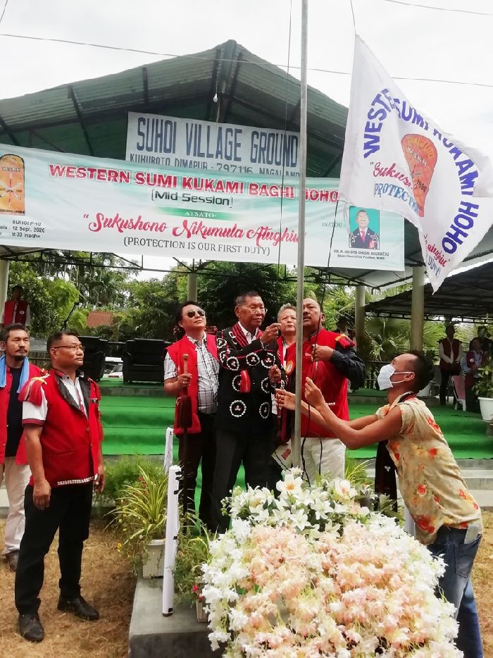 P Nihoto Chishi, first president of WSKH hoisting the hoho flag during the mid-general session held at Suhoi Village on September 12.