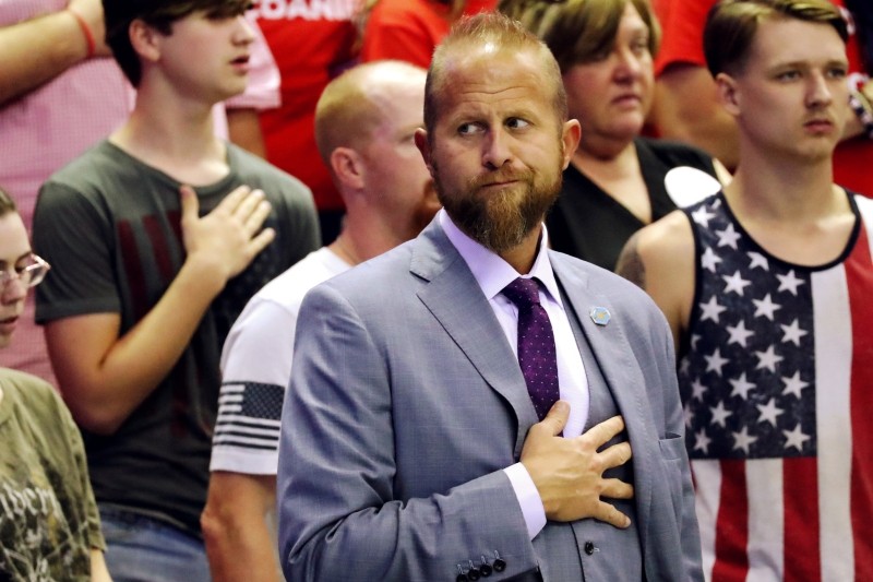 FILE PHOTO: Brad Parscale, Trump 2020 re-election campaign manager, stands for the national anthem as U.S. President Donald Trump rallies with supporters during a Make America Great Again re-election campaign rally in Southaven, Mississippi, U.S., October 2, 2018. REUTERS/Jonathan Ernst/File Photo