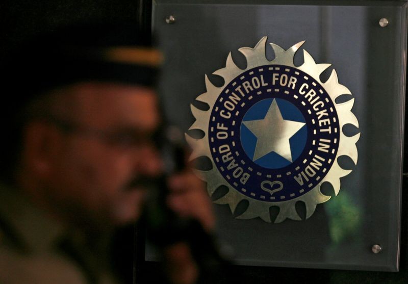 FILE PHOTO: A policeman walks past a logo of the Board of Control for Cricket in India (BCCI) during a governing council meeting of the Indian Premier League (IPL) at BCCI headquarters in Mumbai April 26, 2010. REUTERS/Arko Datta