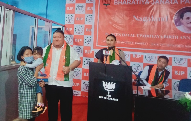 Temjen Imna Along handing over Sukanya Samriddhi account to a girl child in Kohima on September 25. (Morung Photo)