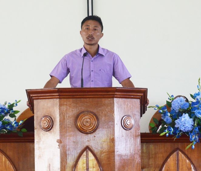Outgoing Youth Pastor of Mopungchuket Baptist Church, L Yanger Pongen speaking during his farewell programme in the village church on September 20, Mopungchuket. (Morung photo)