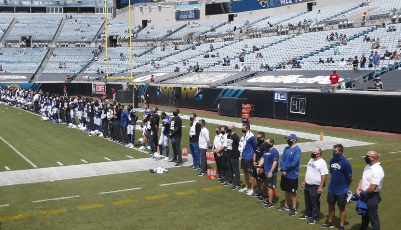 Indianapolis Colts players stand for a special presentation of "It Takes All of Us" before the game against the Jacksonville Jaguars at TIAA Bank Field. (Credit: Reinhold Matay-USA TODAY Sports)