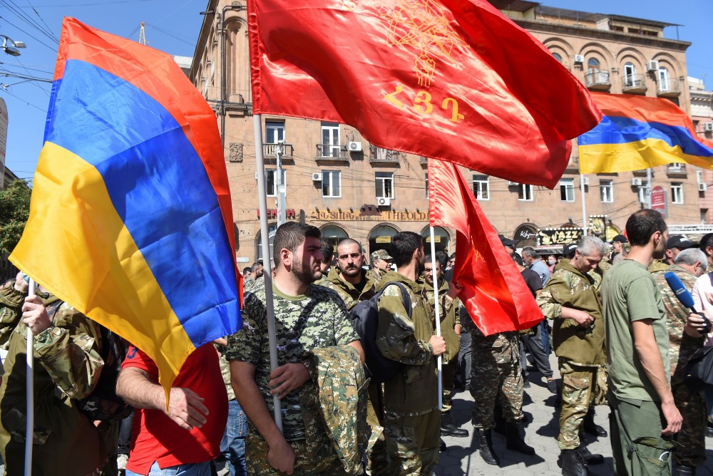 People attend a meeting to recruit military volunteers after Armenian authorities declared martial law and mobilised its male population following clashes with Azerbaijan over the breakaway Nagorno-Karabakh region in Yerevan, Armenia September 27, 2020. Melik Baghdasaryan/Photolure via REUTERS