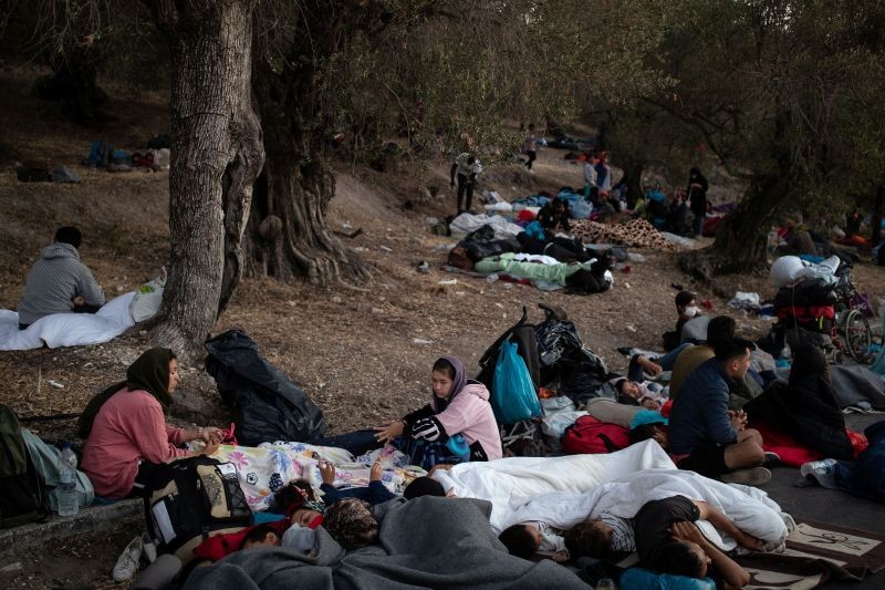 Refugees and migrants find shelter in the woods following a fire at the Moria camp on the island of Lesbos, Greece on September 10, 2020. (REUTERS Photo)