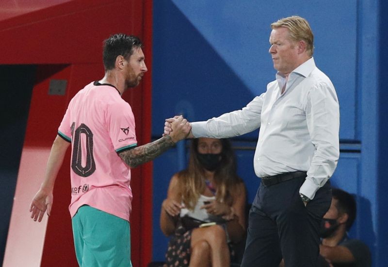 Barcelona's Lionel Messi shakes hands with coach Ronald Koeman as he is substituted off REUTERS/Albert Gea