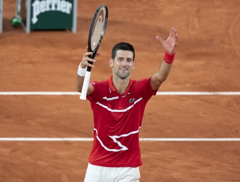Novak Djokovic (SRB) celebrates match point during his match against Karen Khachanov (RUS) on day eight at Stade Roland Garros. Mandatory Credit: Susan Mullane-USA TODAY Sports
