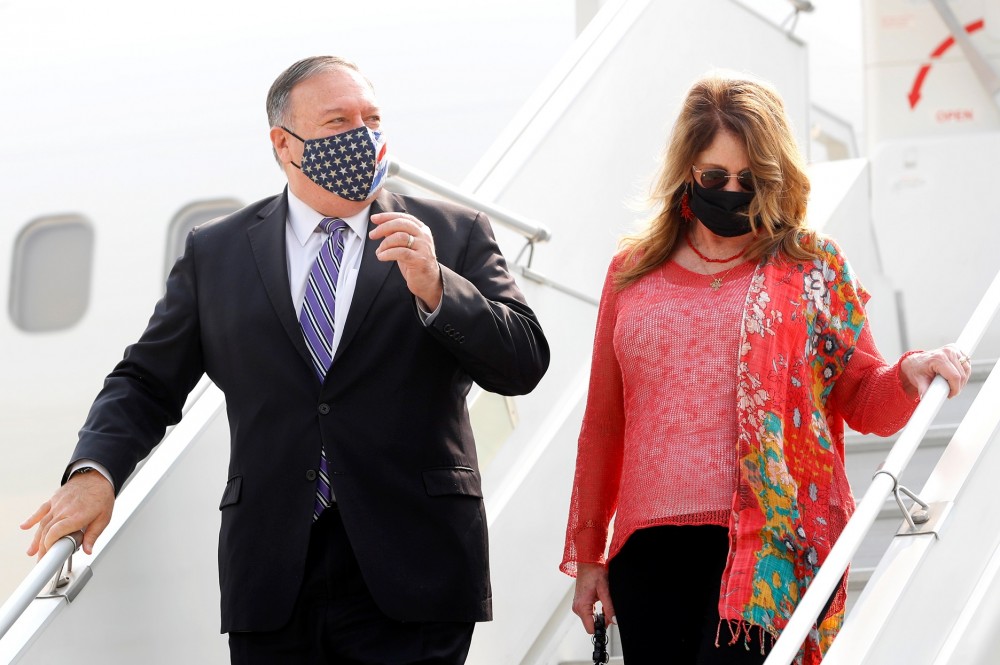 U.S. Secretary of State Michael Pompeo and his wife Susan disembark from an aircraft upon their arrival at an airport in New Delhi, India, October 26, 2020. REUTERS/Adnan Abidi/Pool