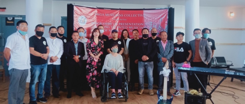 The recipients with others Diethono Nakhro, Theja Meru, members of NMC and others with recipients. (Morung Photo)