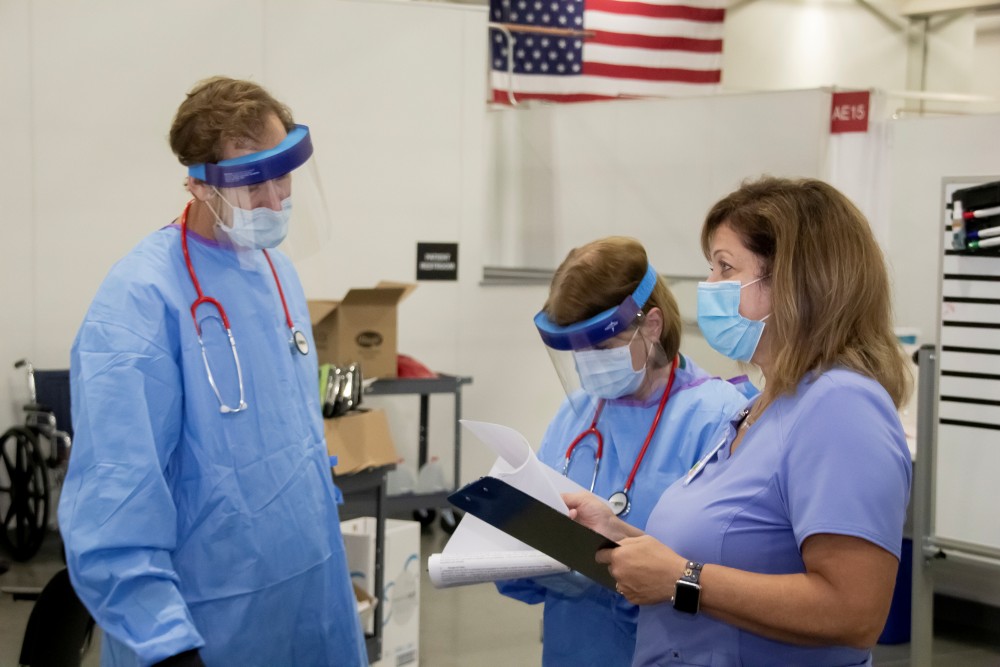 FILE PHOTO: Medical personnel work inside a field hospital known as an Alternate Care Facility at the state fair ground as cases of coronavirus disease (COVID-19) cases spike in the state near Milwaukee, Wisconsin, U.S., October 12, 2020. Wisconsin Department of Administration/Handout via REUTERS