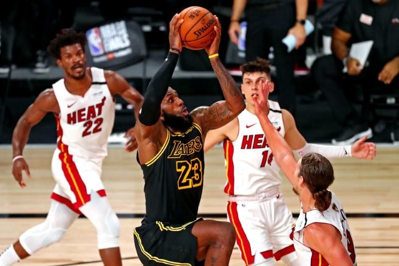 Los Angeles Lakers forward LeBron James (23) drives to the basket against Miami Heat forward Kelly Olynyk (9) during the fourth quarter in game two of the 2020 NBA Finals at AdventHealth Arena. (USA TODAY Sports Photo via Reuters)